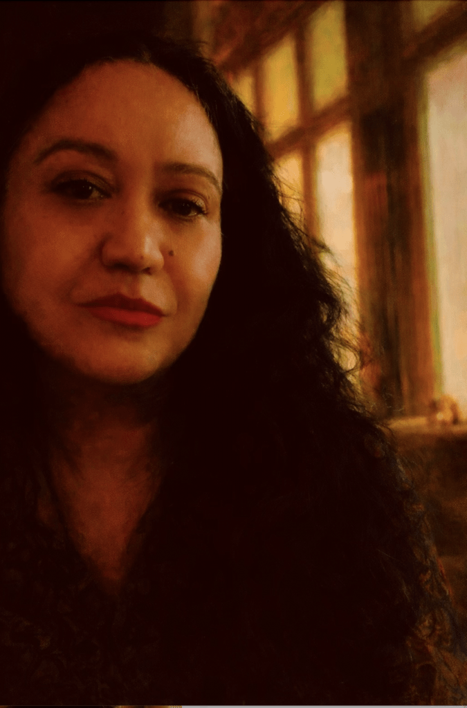 Painterly portrait of a woman in a calm, reflective pose with warm soft light and an inward expression